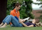 students relaxing on lawn